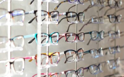 arranged assorted-color eyeglasses on rack